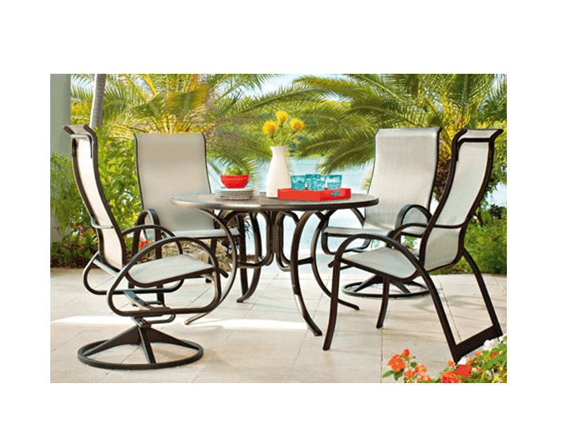 chairs around a table in tropical setting