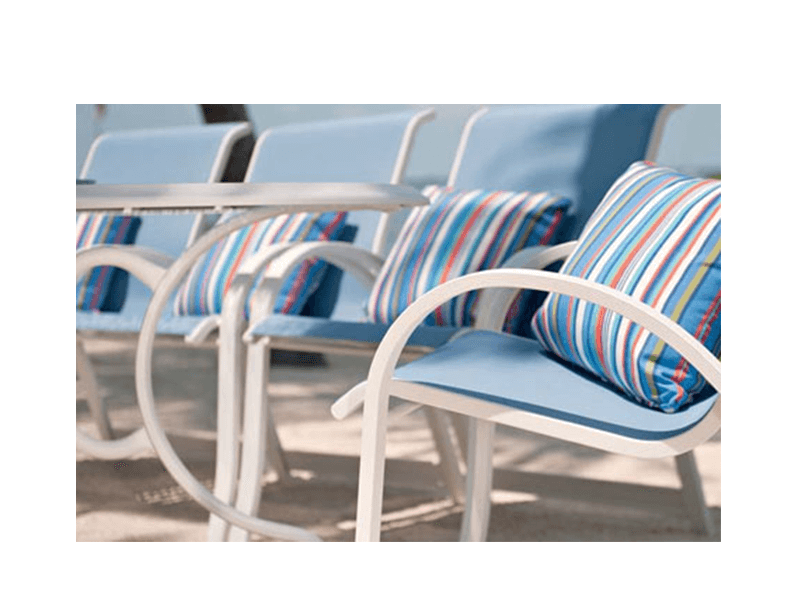 close up of sling chairs with striped pillows