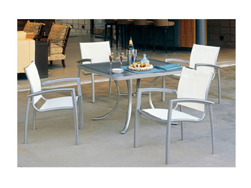 four chairs and a table on patio