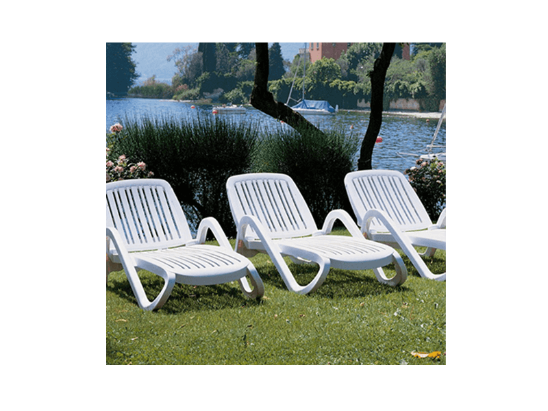 Three Nardi Eden Chaise lounges on grass