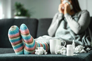 Sick woman on couch 