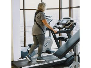 Woman walking to lose weight on a treadmill
